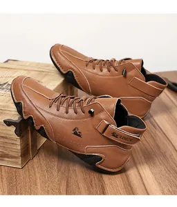 Detail of brown pebbled leather men's boot with logo and durable rubber wave sole