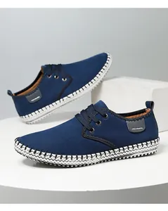 Close-up of deep blue casual men shoe with distinct black and white braided sole stitching