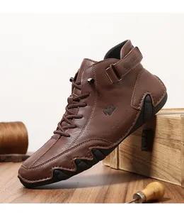 Detail view of brown leather high-top boots with LDECK logo and non-slip rubber sole