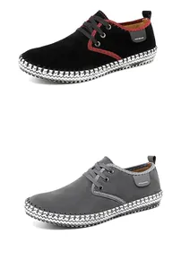 Detail showing black and grey handmade casual shoes with white stitching on sole