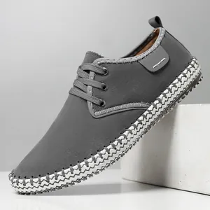 Handmade men's grey suede casual sneaker with unique black and white woven sole edge detail