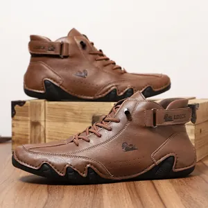Brown leather high-top men's boots with rugged rubber sole and adjustable strap