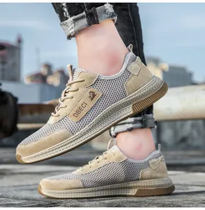Detail of khaki men's breathable mesh sneakers with durable leather stitching and rubber sole