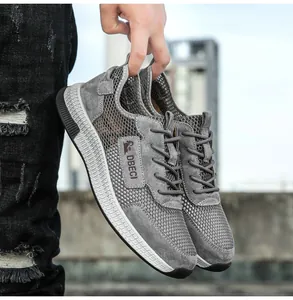 Close-up of breathable grey mesh and matte leather panel on men casual sneakers