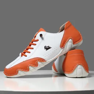 Baskets décontractées en cuir orange et blanc pour hommes avec semelle en gomme ondulée
