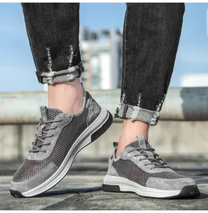 Detail of grey leather mesh casual sneakers showing breathable texture and outdoor style