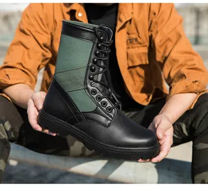 Detailansicht der taktischen High-Top-Stiefel aus schwarzem Leder und olivgrünem Canvas