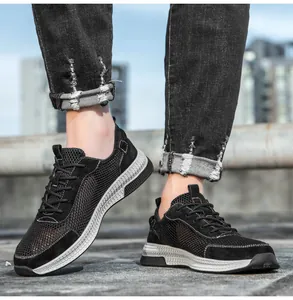 Close-up of men's black breathable mesh sneakers with leather panels and white stitching