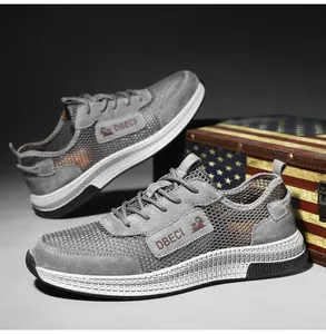 Detailed shot of breathable gray mesh and suede sneakers on a vintage wooden background