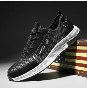 Close-up of breathable mesh texture and leather stitching on black outdoor casual men's sneakers