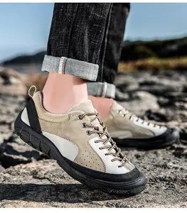 Detail of khaki suede hiking shoe with breathable mesh and rugged anti-slip rubber sole