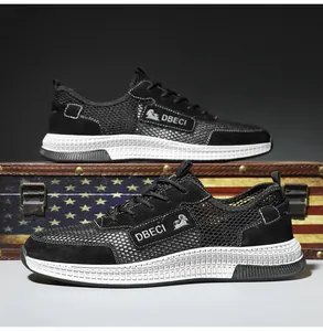 Close-up of black breathable mesh and leather men's sneakers on a vintage trunk