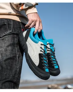 Outdoor close-up of men's hiking shoes with suede paneling and non-slip rubber soles