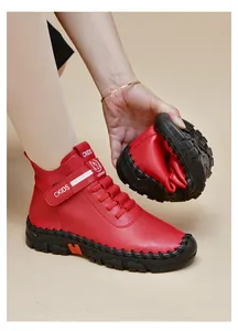 Flexible non-slip rubber sole of red leather boots showing superior bending durability