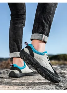 Outdoor hiking shoes with durable rubber soles and breathable mesh on rocky terrain
