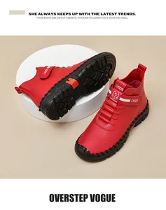 Detail view of red women's boots featuring velcro straps and durable anti-slip rubber soles