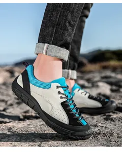 Detail of suede and mesh upper with durable rubber outsole on rugged terrain