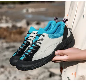 Detailed view of blue suede hiking shoes with breathable mesh and anti-slip rubber soles