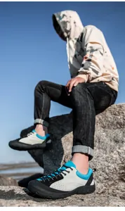 Outdoor shot of men's suede hiking shoes with breathable mesh and anti-slip rubber soles