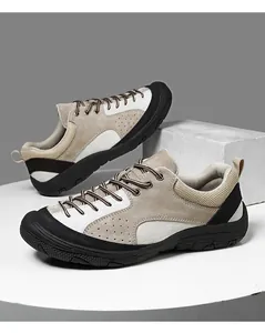 Detail of khaki hiking shoes with suede upper, breathable mesh and durable rubber sole