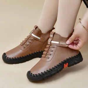 Brown women's martin boots with velcro closure and durable black non-slip rubber soles