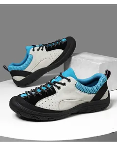 Detailed side view of suede hiking shoes with breathable mesh and anti-slip rubber soles