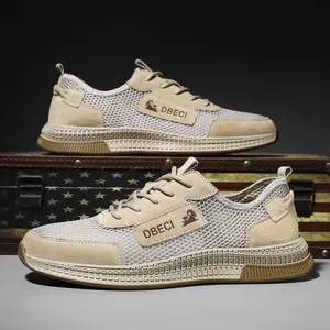 Men's khaki breathable leather sneakers with mesh panels on a vintage suitcase