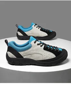 Detail of hiking shoes with suede and mesh, showcasing reinforced lacing and heel pull tab