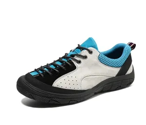 Macro detail of breathable blue mesh lining and grey suede texture on hiking shoes