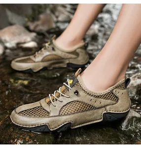 Outdoor view of khaki leather mesh wading shoes for men featuring breathable side drainage holes