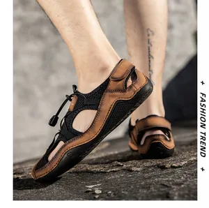 Detail of brown leather hiking sandals with elastic quick-lace system and protective toe cap