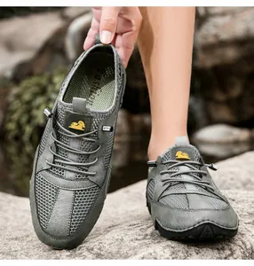 Macro detail of breathable mesh and leather outdoor sneaker with sheep logo and anti-slip sole