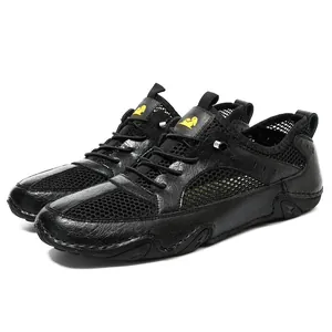Detailed macro view of black leather and mesh paneling on men's casual athletic shoes