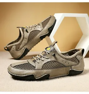 Close-up of khaki leather and breathable mesh material on men's outdoor casual sneakers