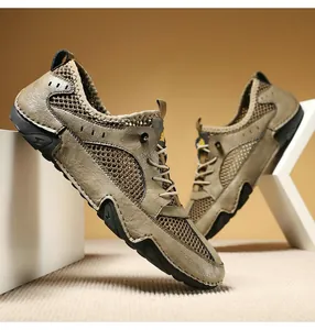 Detail view of khaki leather and mesh sneakers featuring non-slip lightning bolt rubber soles