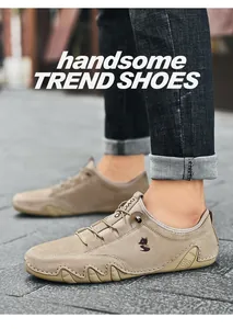 Macro detail of khaki leather casual shoes with wolf logo and textured wave sole