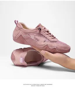 Macro shot of pink mesh and suede panels on lightweight women's casual sport shoes