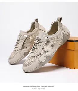 Detail of breathable mesh and suede panels on beige outdoor sneakers with wavy texture