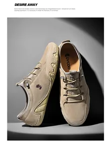 Detail of premium khaki suede men's loafers with a wave-patterned anti-slip rubber sole