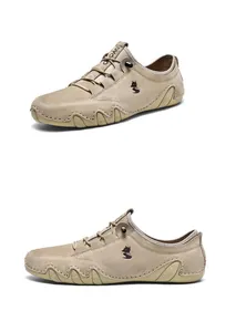 Detail of khaki genuine leather men's shoe featuring durable rubber anti-slip sole