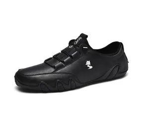 Detail view of premium black leather low-top casual shoes with fox logo and lace system