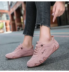 Outdoor close-up of pink suede casual sneakers for women featuring DBECI branding