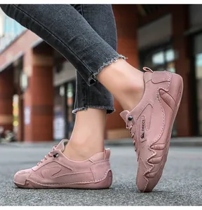 Detail of pink suede leisure shoes with handcrafted stitching and durable rubber sole