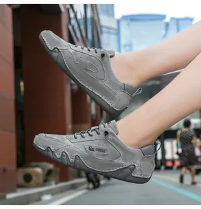 Detail shot of gray suede leather outdoor casual shoe with durable non-slip rubber sole