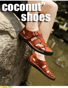 Outdoor shot of men's tan leather sandals with cutout design and Velcro strap