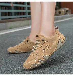 Close-up of khaki suede casual shoes featuring wavy stitching and durable rubber outsoles