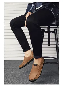 Close-up of brown leather slip-on shoes with visible hand-stitched detailing for men
