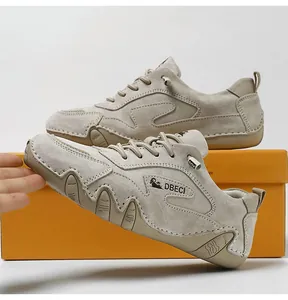 Detail of grey suede leather casual sneaker featuring side logo and anti-slip sole texture