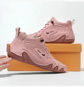 Detail of pink genuine leather high-top sneakers with DBECI logo and non-slip sole