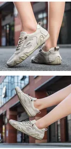 Close-up of beige outdoor mesh sneakers with suede details and rugged rubber sole